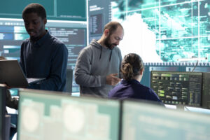 Governmental hackers working on computer network in high tech office