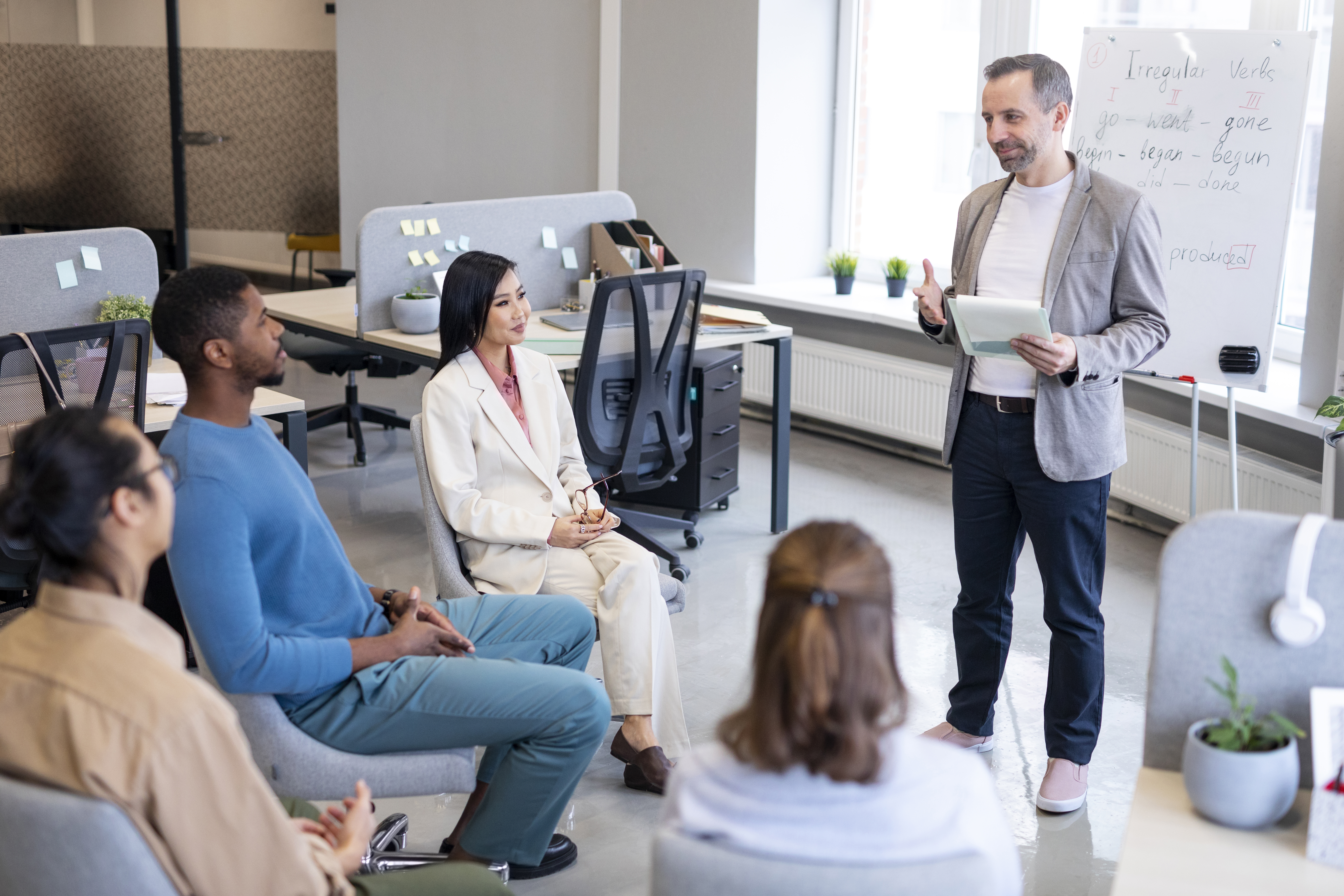 Related image in Career Development category for Driving Trust through Digital Security and Governance post | medium shot colleagues learning work